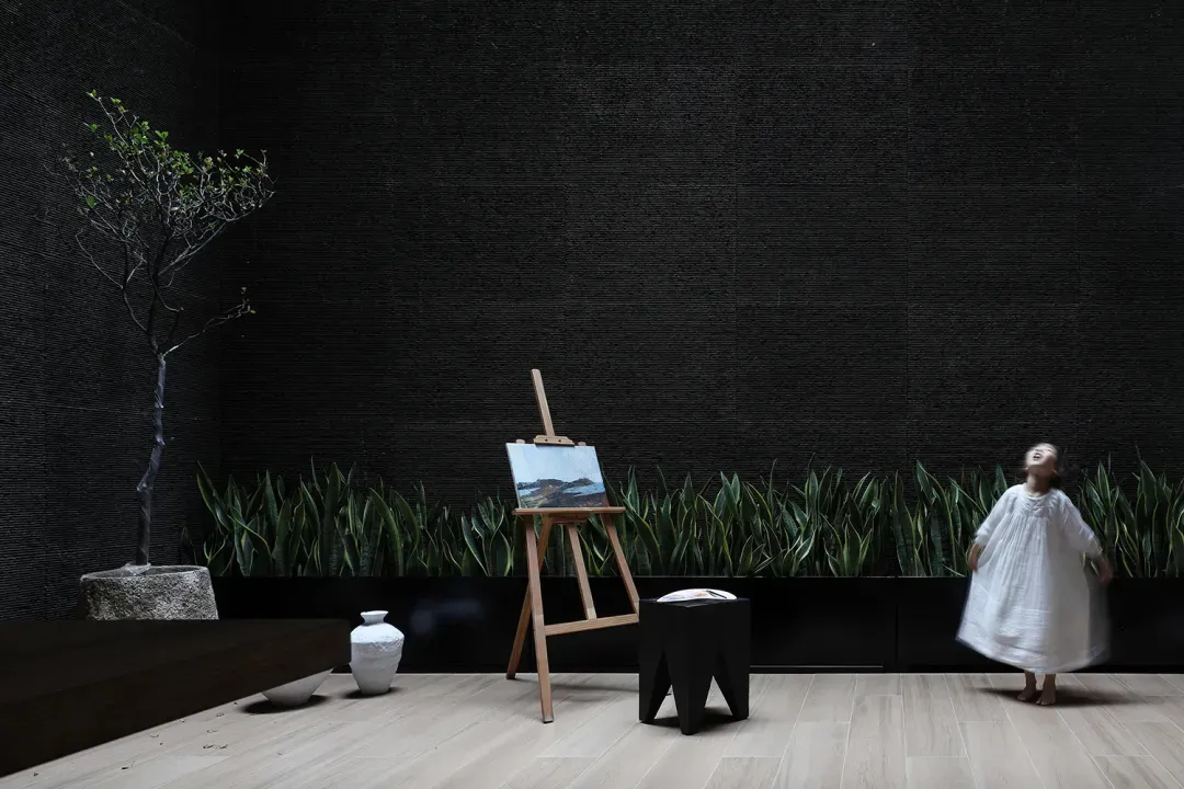 A minimalist bedroom featuring modern furniture and a cozy ambiance.