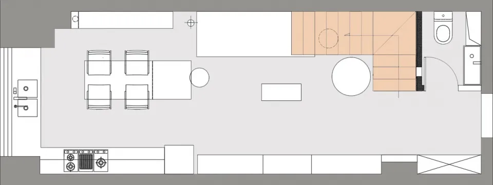 現代開放式客廳空間,牆面採用中性色調,背景設有樓梯。