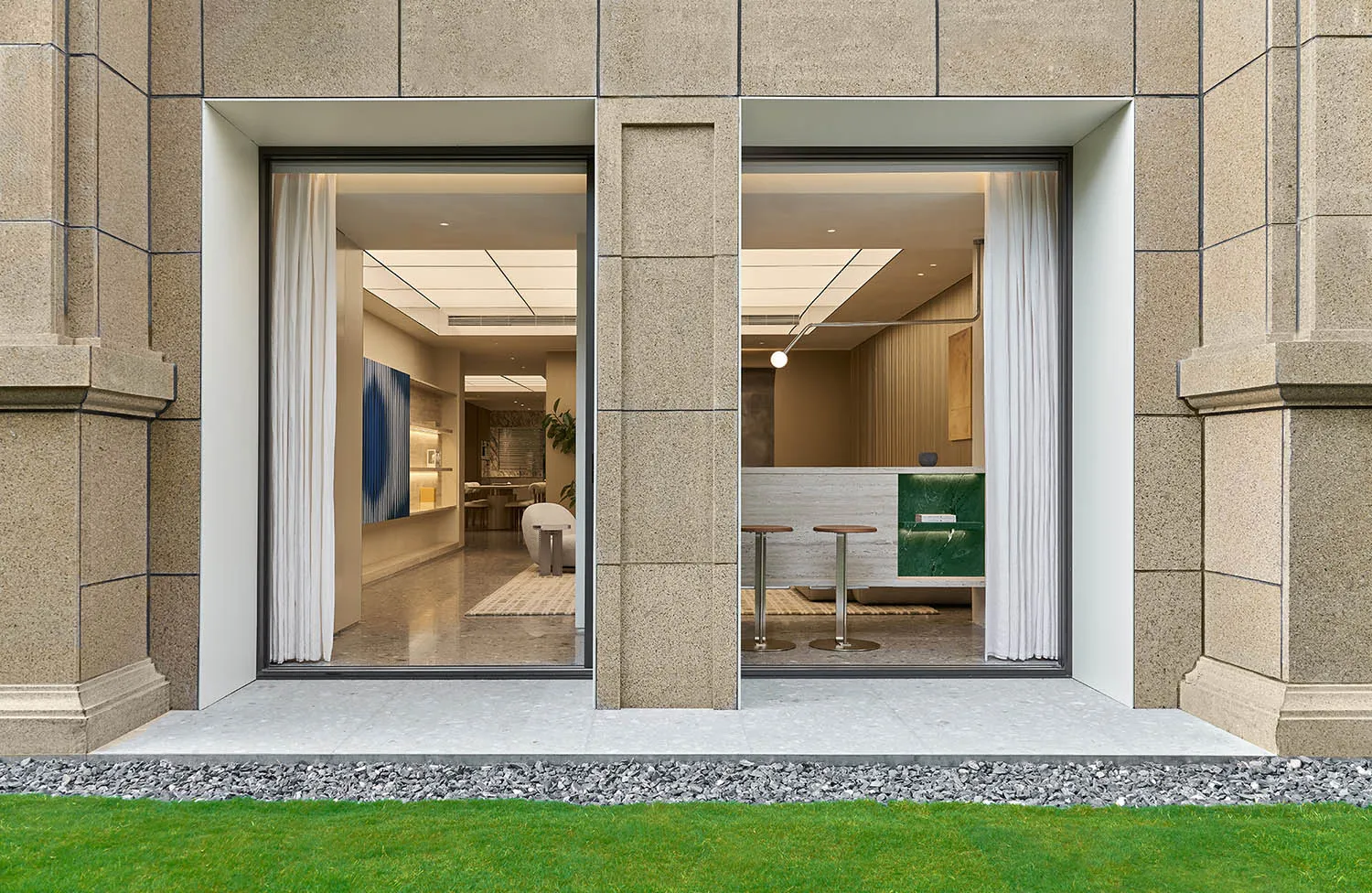 Modern retail storefront featuring large glass windows