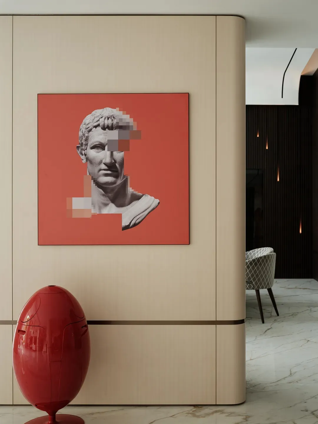 Modern art piece featuring a concrete wall with abstract design on a red background.