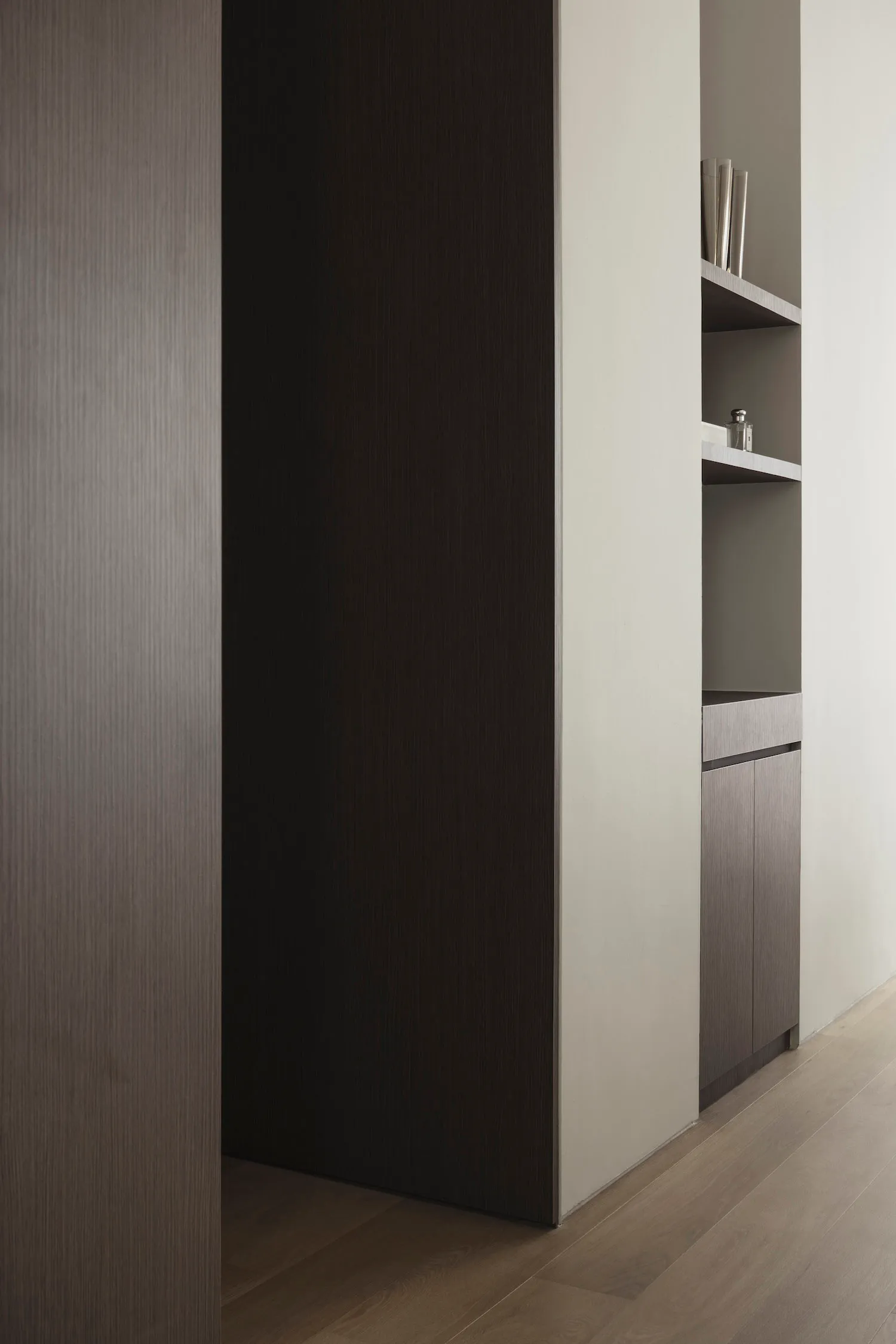 A modern, minimalist hallway with wooden walls and a sleek design.