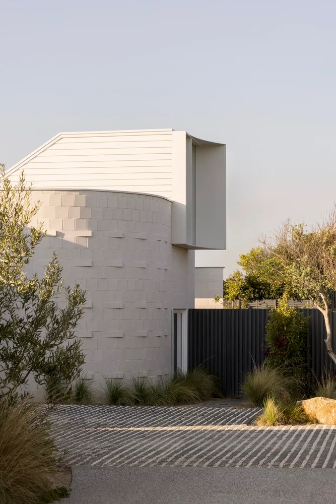 Modern residential building exterior with concrete and wooden elements
