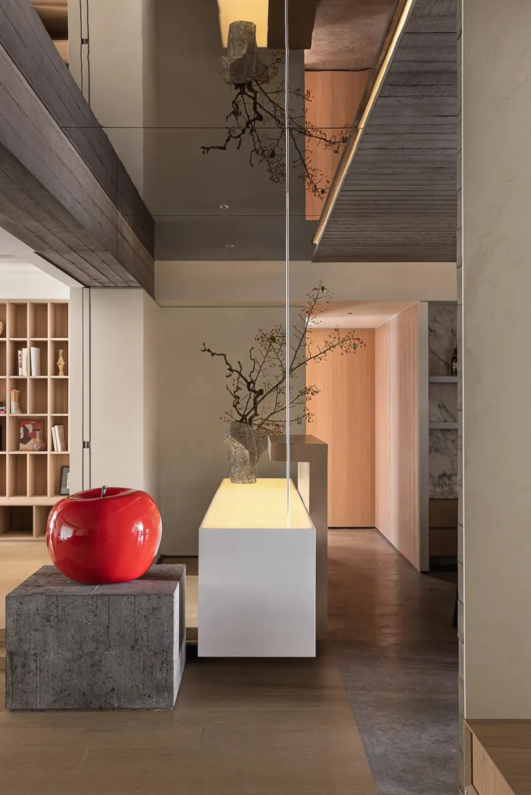 Modern residential entryway featuring concrete, wood, and glass materials