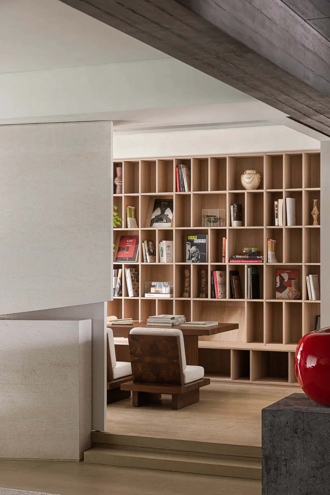 Modern library with wooden bookshelf and chairs
