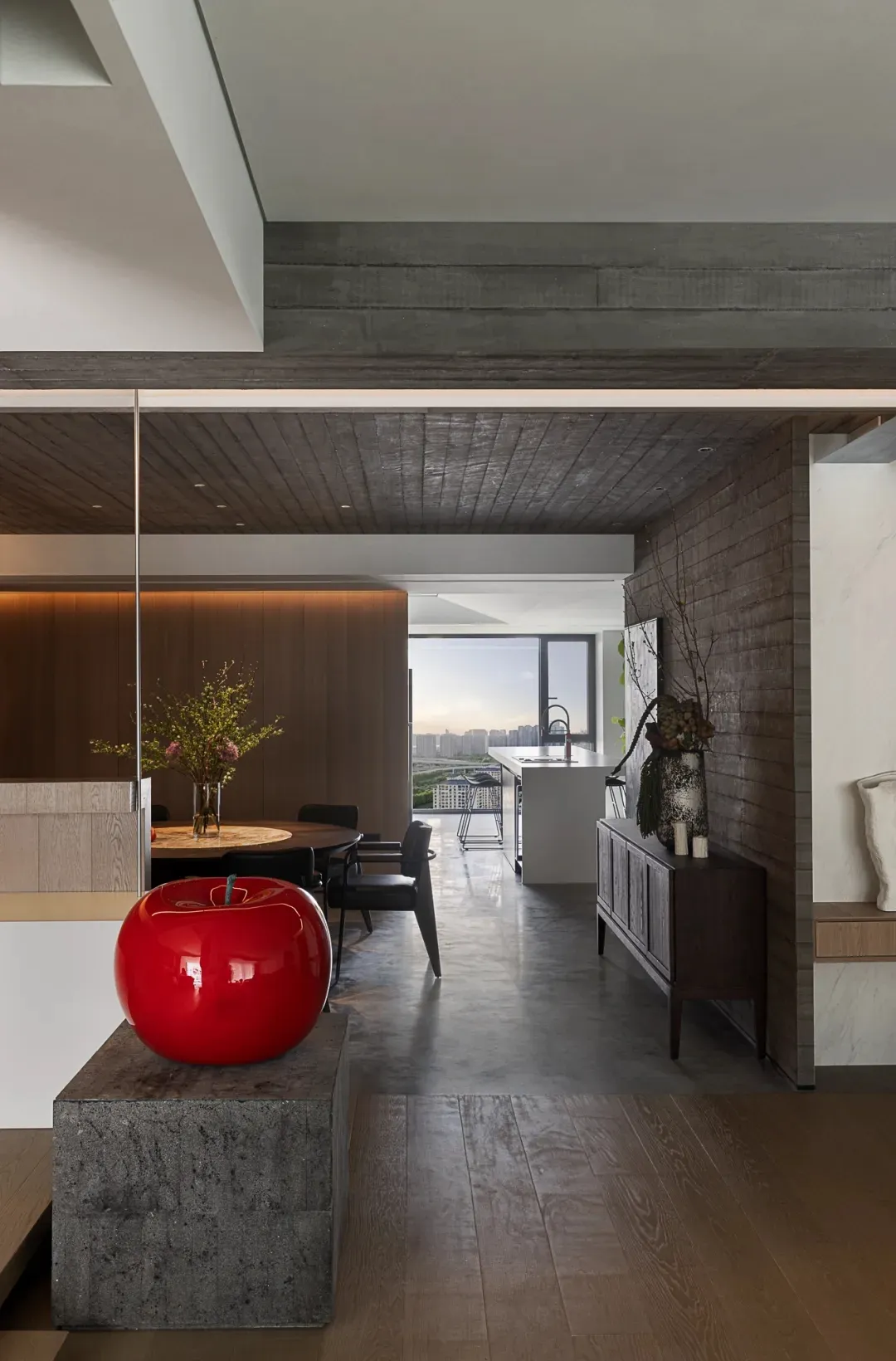 A modern residential kitchen featuring wood elements and a sleek design.