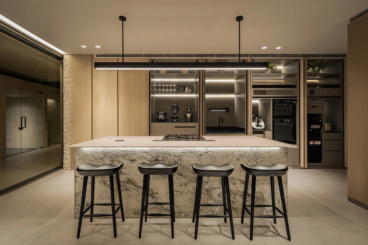 Modern studio apartment featuring concrete walls and floors.