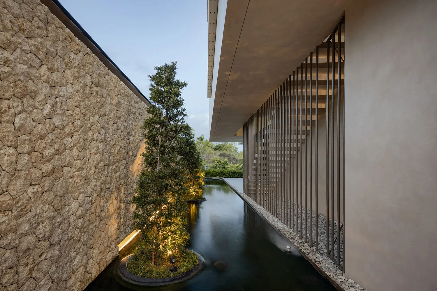 A minimalist exterior space with concrete and metal elements.