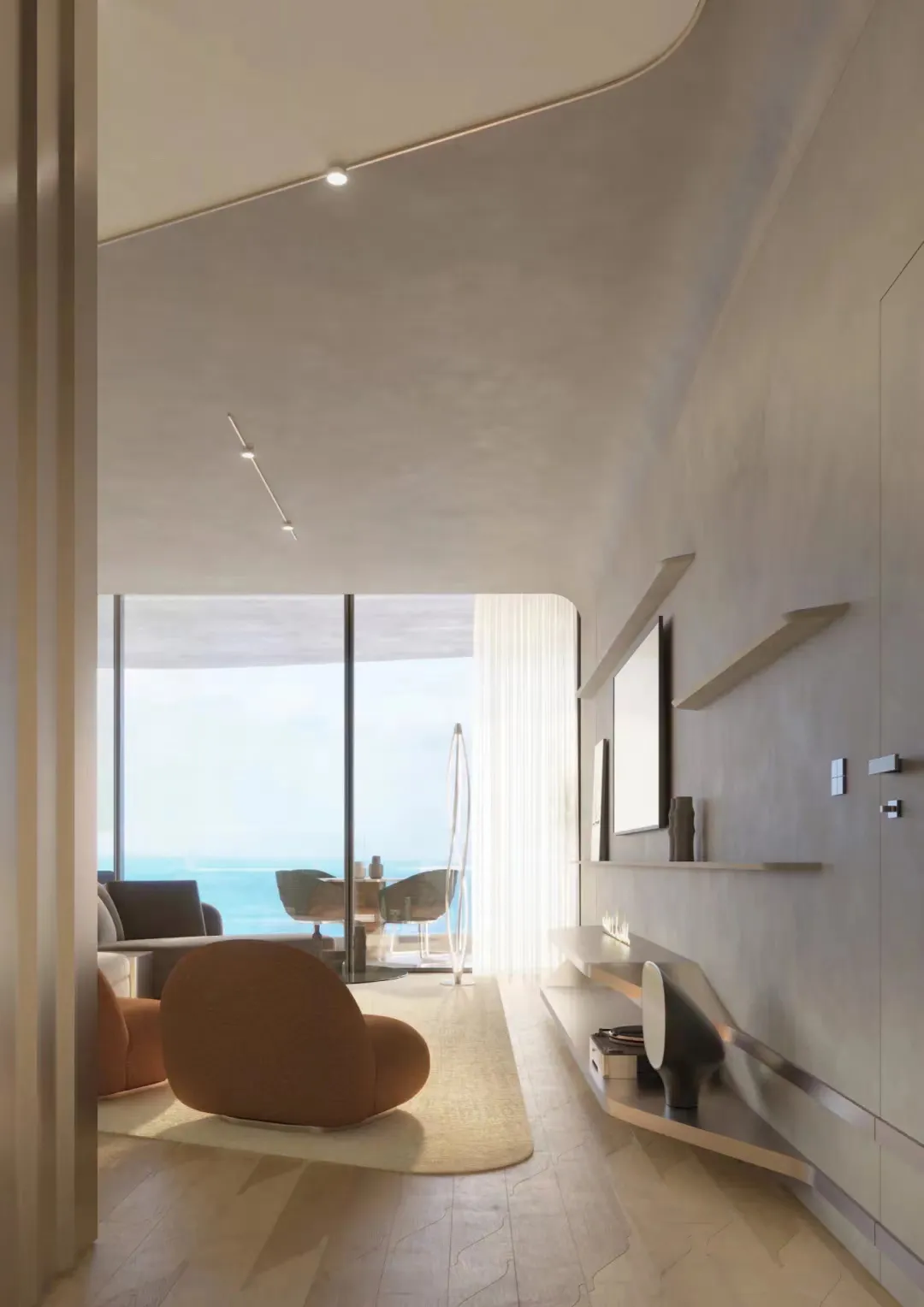 Modern living room with minimalist furniture and large windows overlooking the ocean.