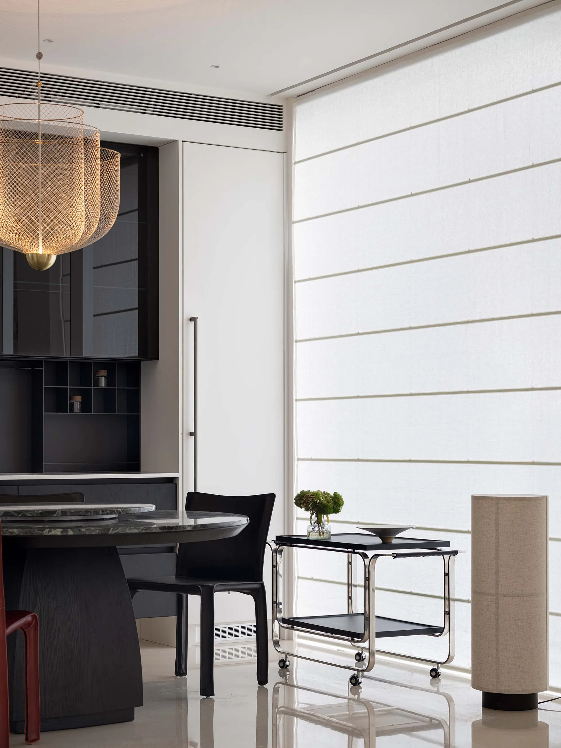 Modern living room featuring metal, fabric, wood, and glass furniture.
