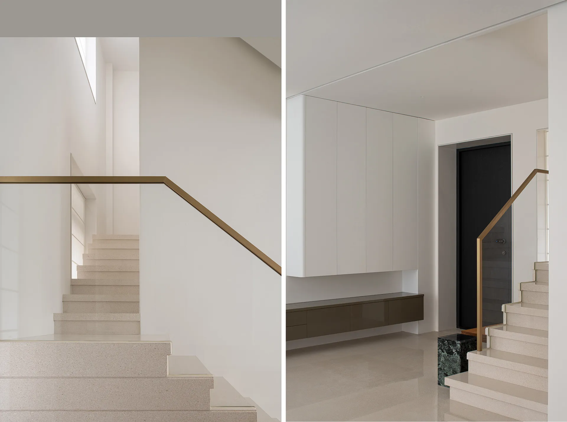 Modern white concrete staircase with gold aluminum railings and black door in an interior space with minimalist design elemen