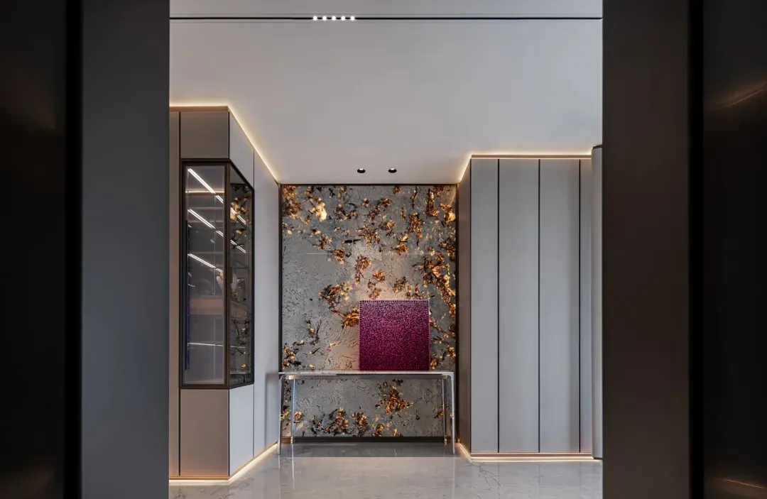 Modern hallway featuring marble and glass surfaces