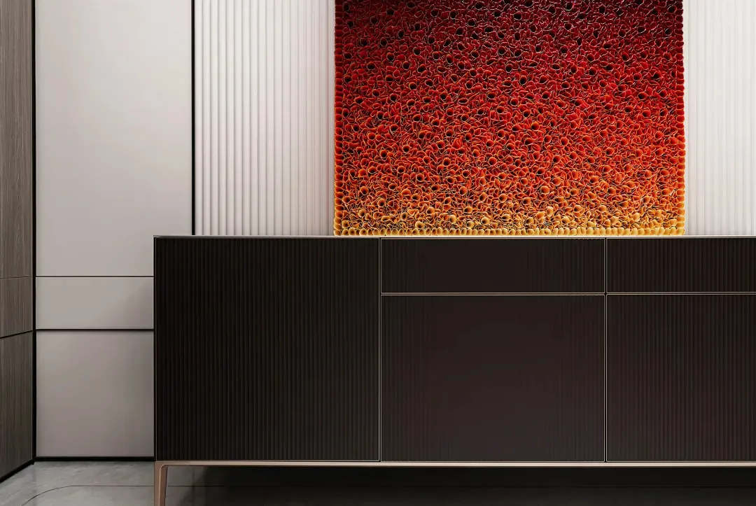 Modern living room with dark wooden floor, black cabinet with metallic accents, and red abstract wall art.