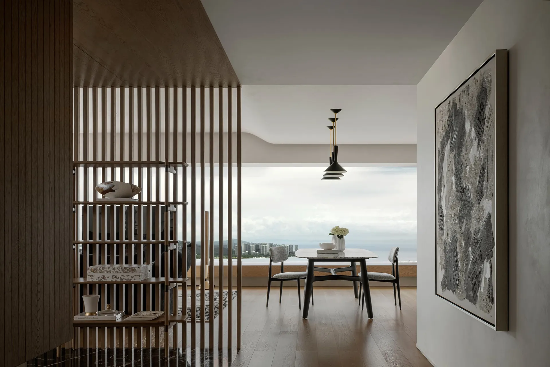 Modern interior design featuring a marble coffee table and gray sofas.