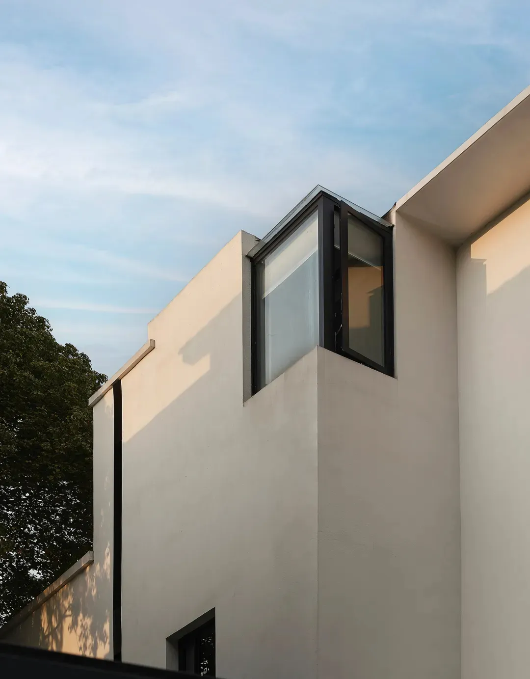 Modern building exterior with concrete and glass materials.
