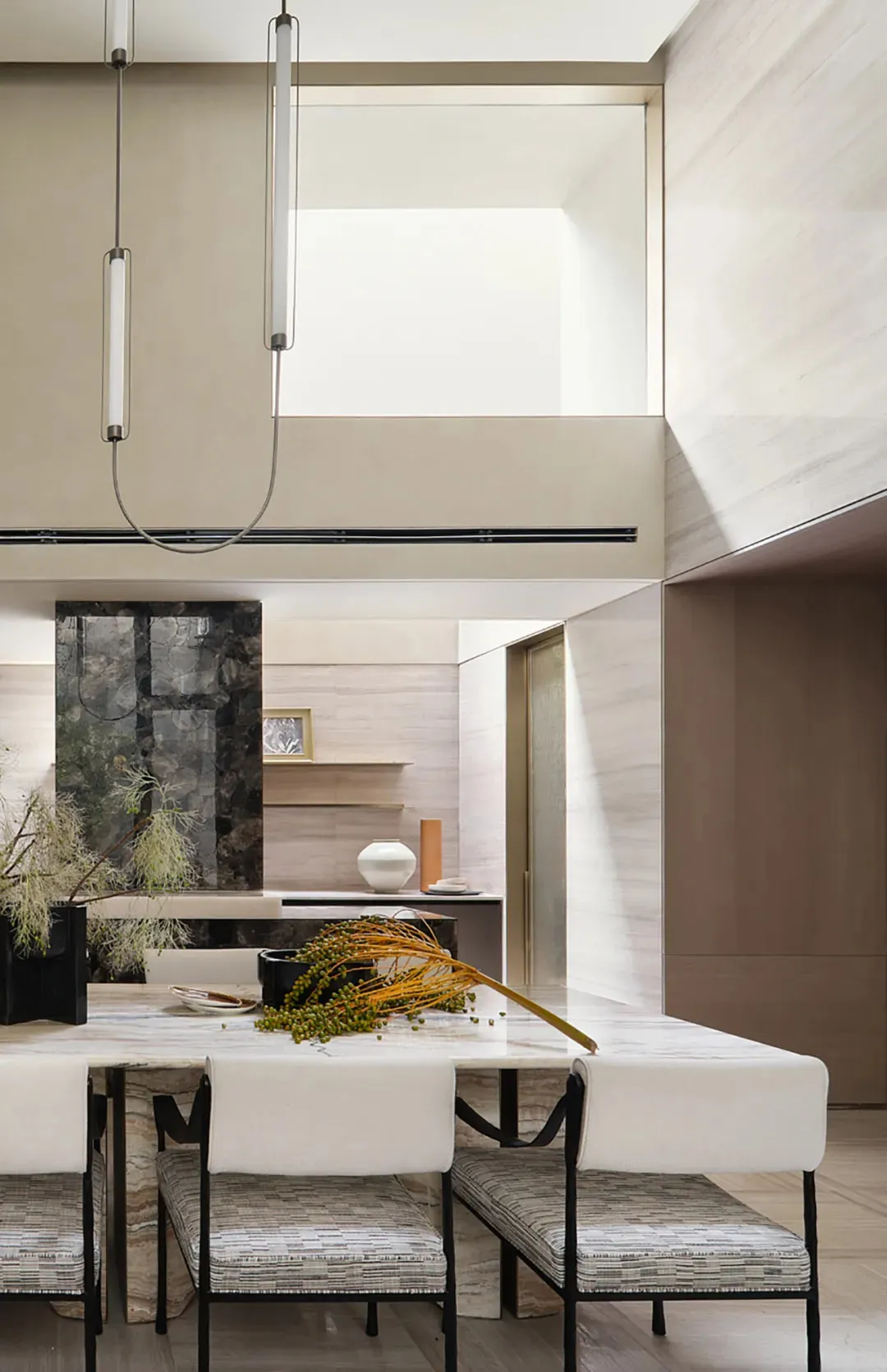 Modern kitchen with marble countertops and wood accents