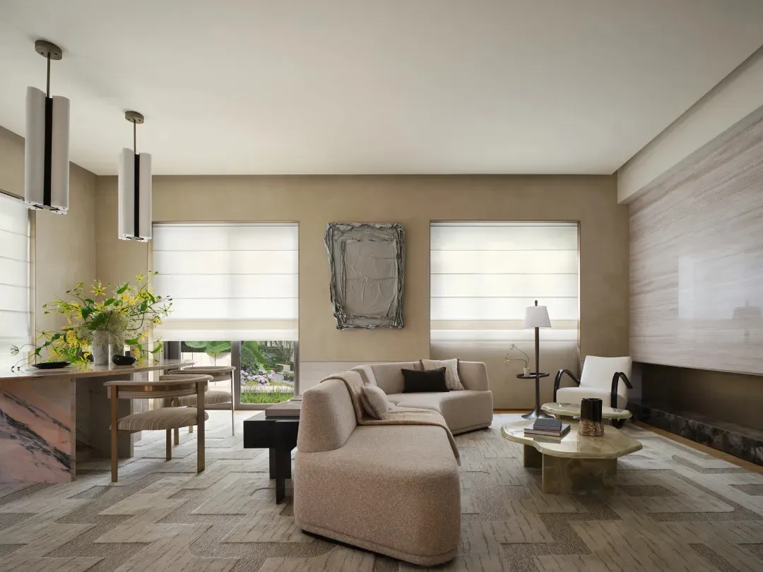 Modern living room with neutral-toned furniture and minimalist design elements.