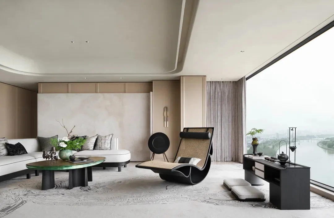Modern living room featuring a leather sofa, glass table, and wooden elements.