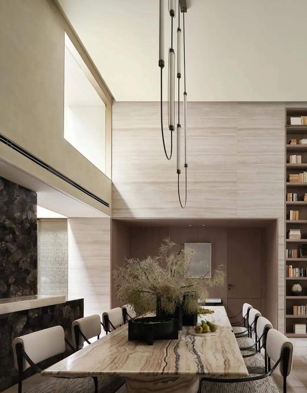 Modern dining room with marble table and chairs.