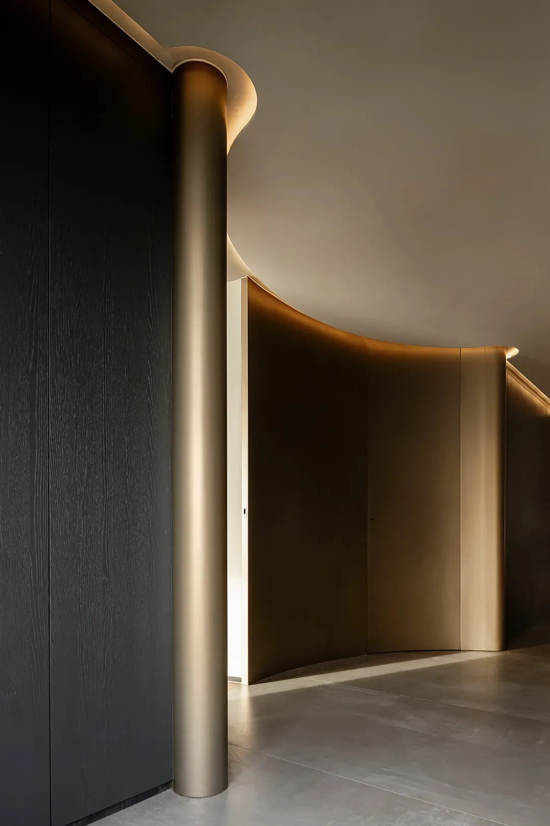 A sleek, modern entrance area featuring metallic mesh paneling and illuminated features.