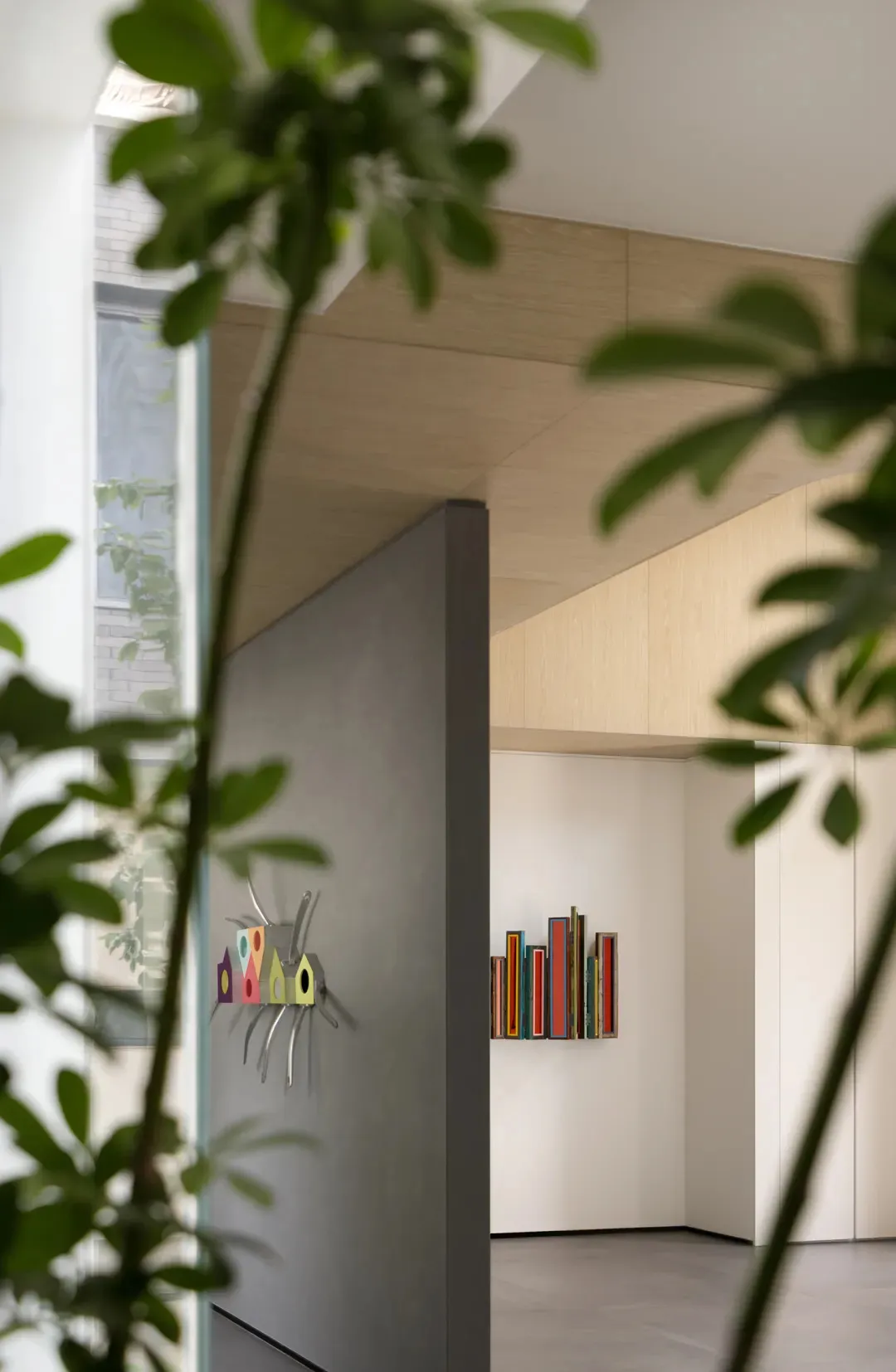 Modern entryway featuring a glass panel wall
