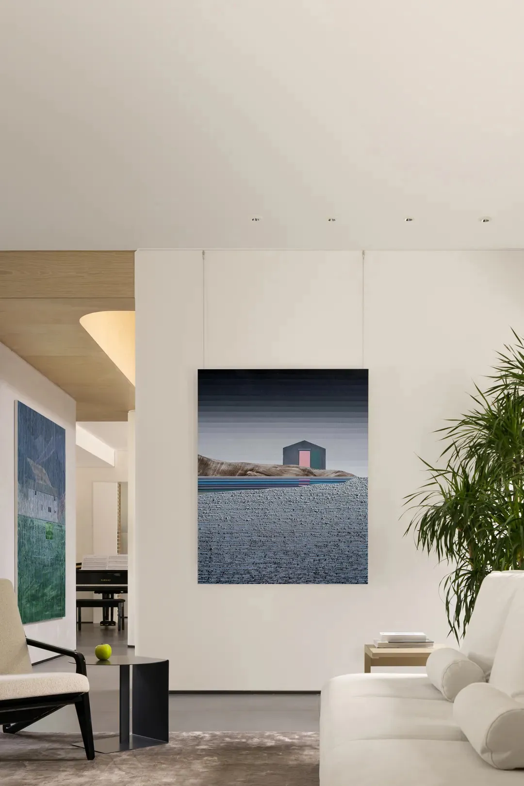 A modern interior living room featuring abstract paintings with a minimalist design.