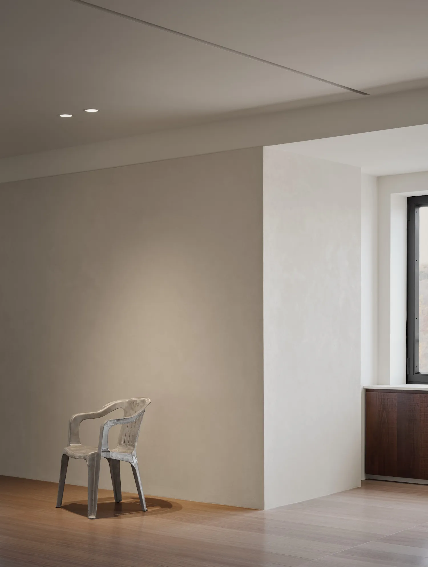 A minimalist interior design featuring neutral tones and simple lines.