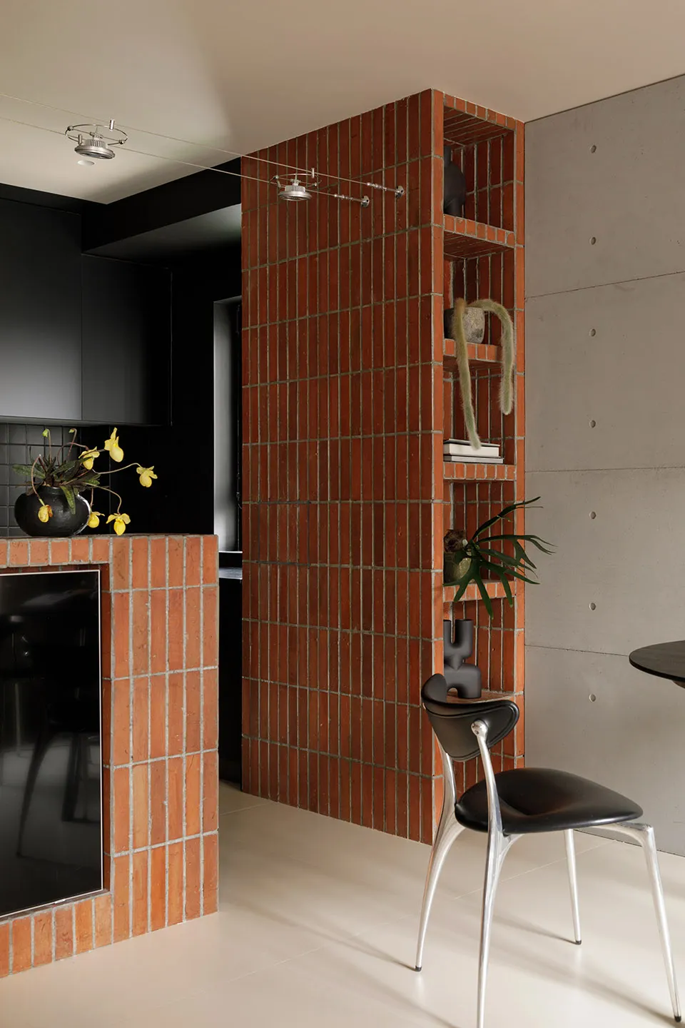 Modern industrial kitchen with brick and concrete split-level design