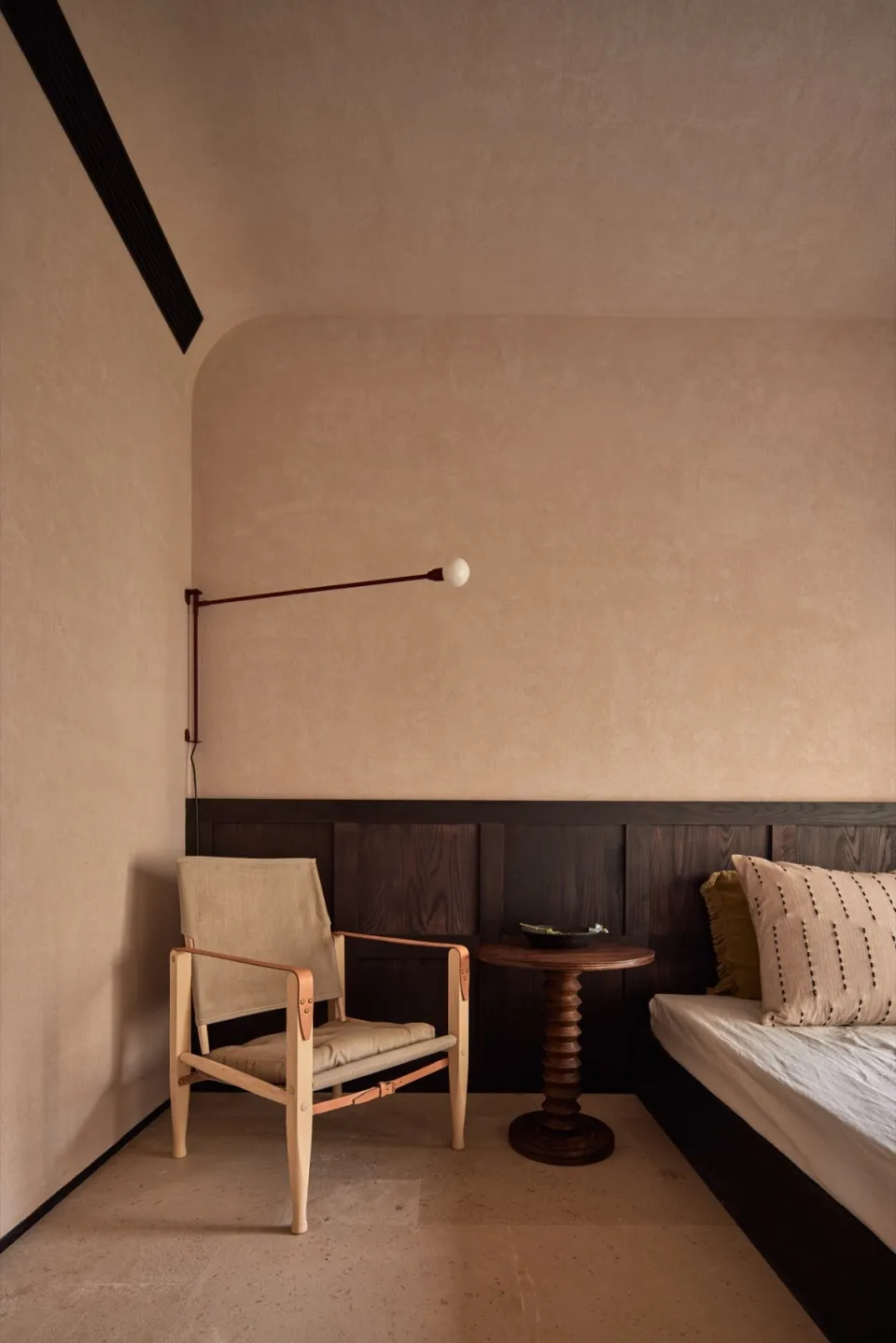Modern minimalist bedroom with wooden furniture and fabric accents