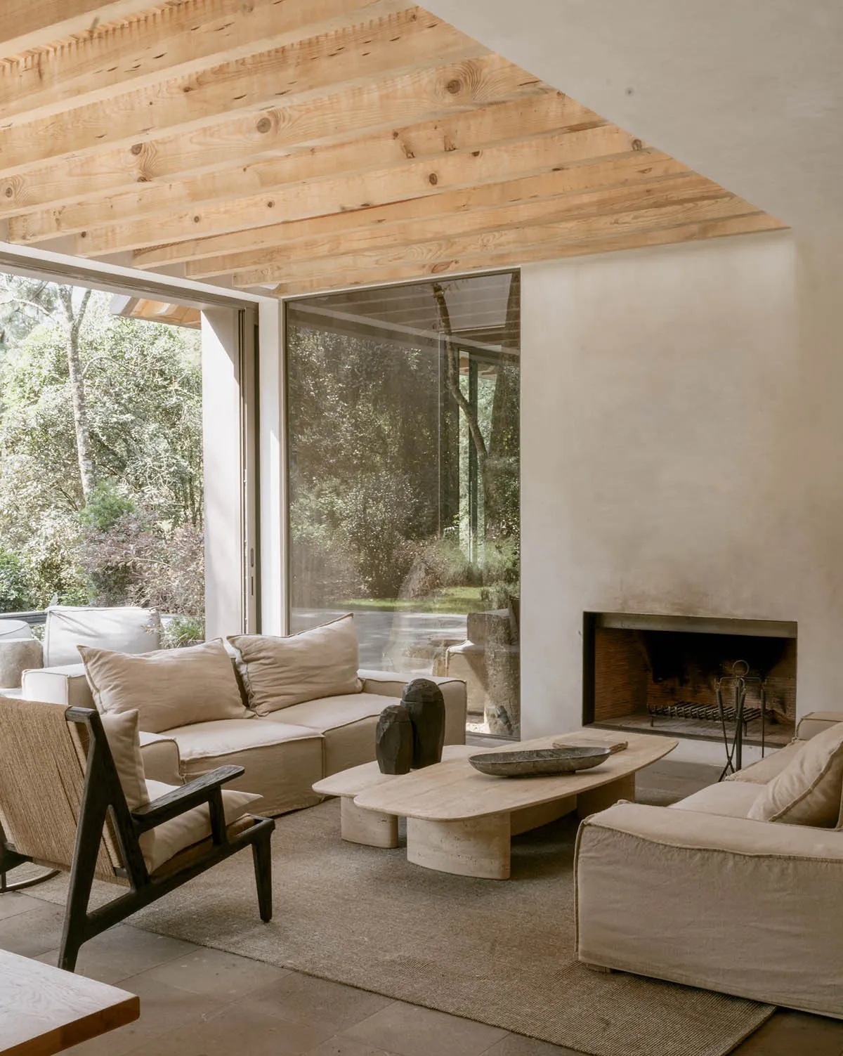 Modern minimalist living room featuring concrete and wood materials.