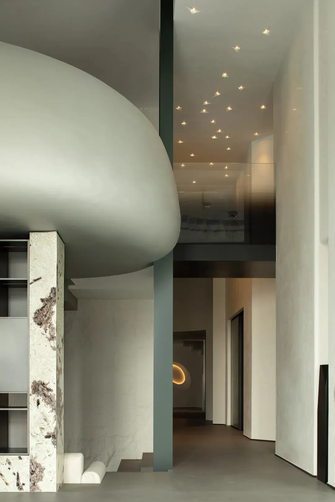 Modern minimalist entrance hall with concrete walls and ceiling lights