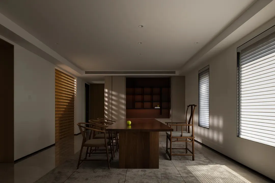 Modern minimalist dining room features wooden table and chairs, creating a clean and elegant space.
