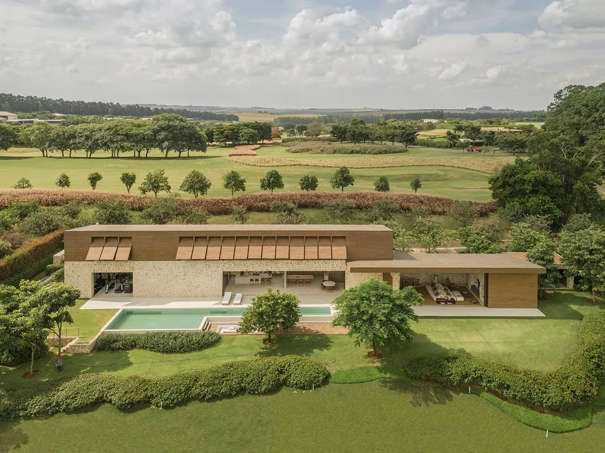 Residential architectural design featuring modern materials like wood and stone