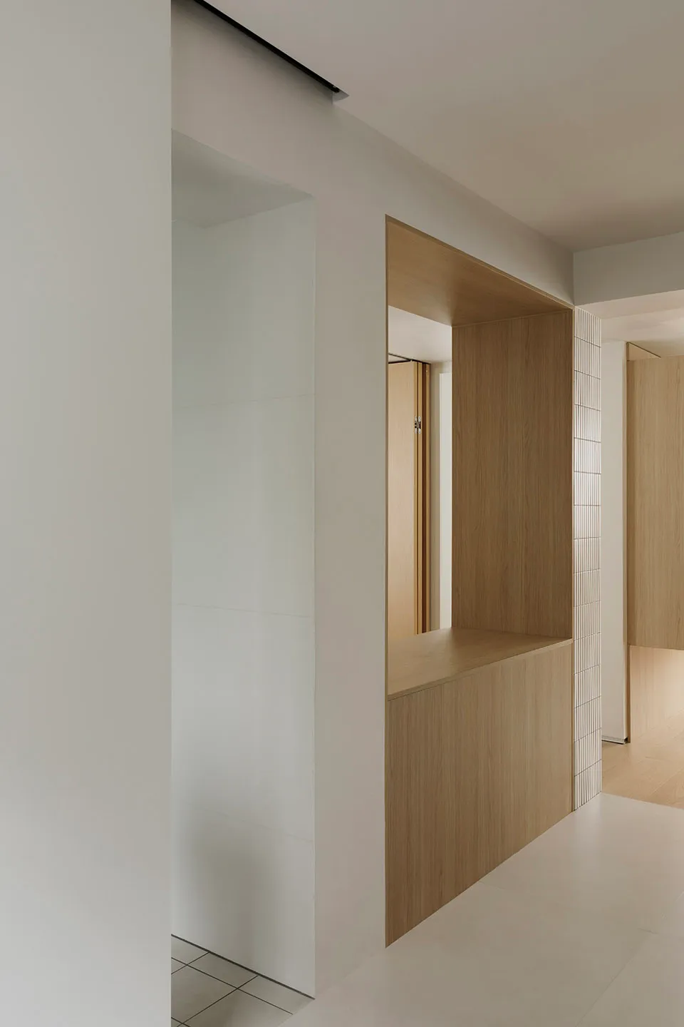Minimalist room featuring wooden furniture.