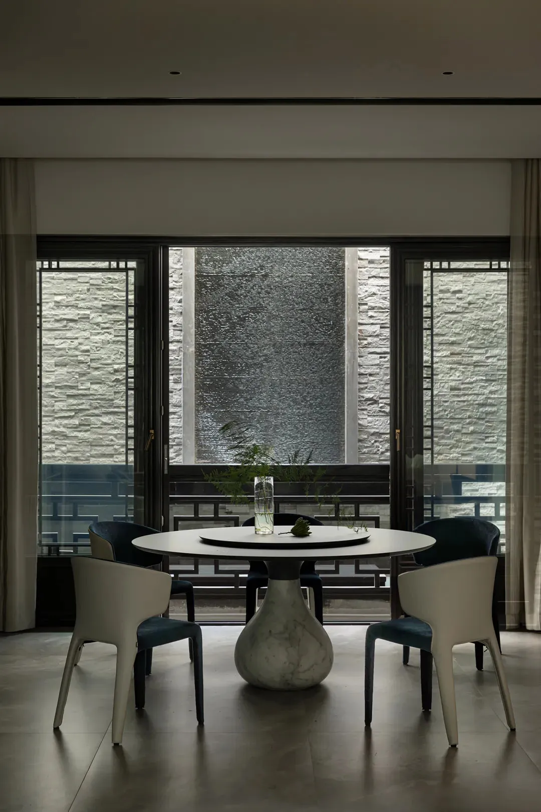 Modern dining room with marble table and chairs