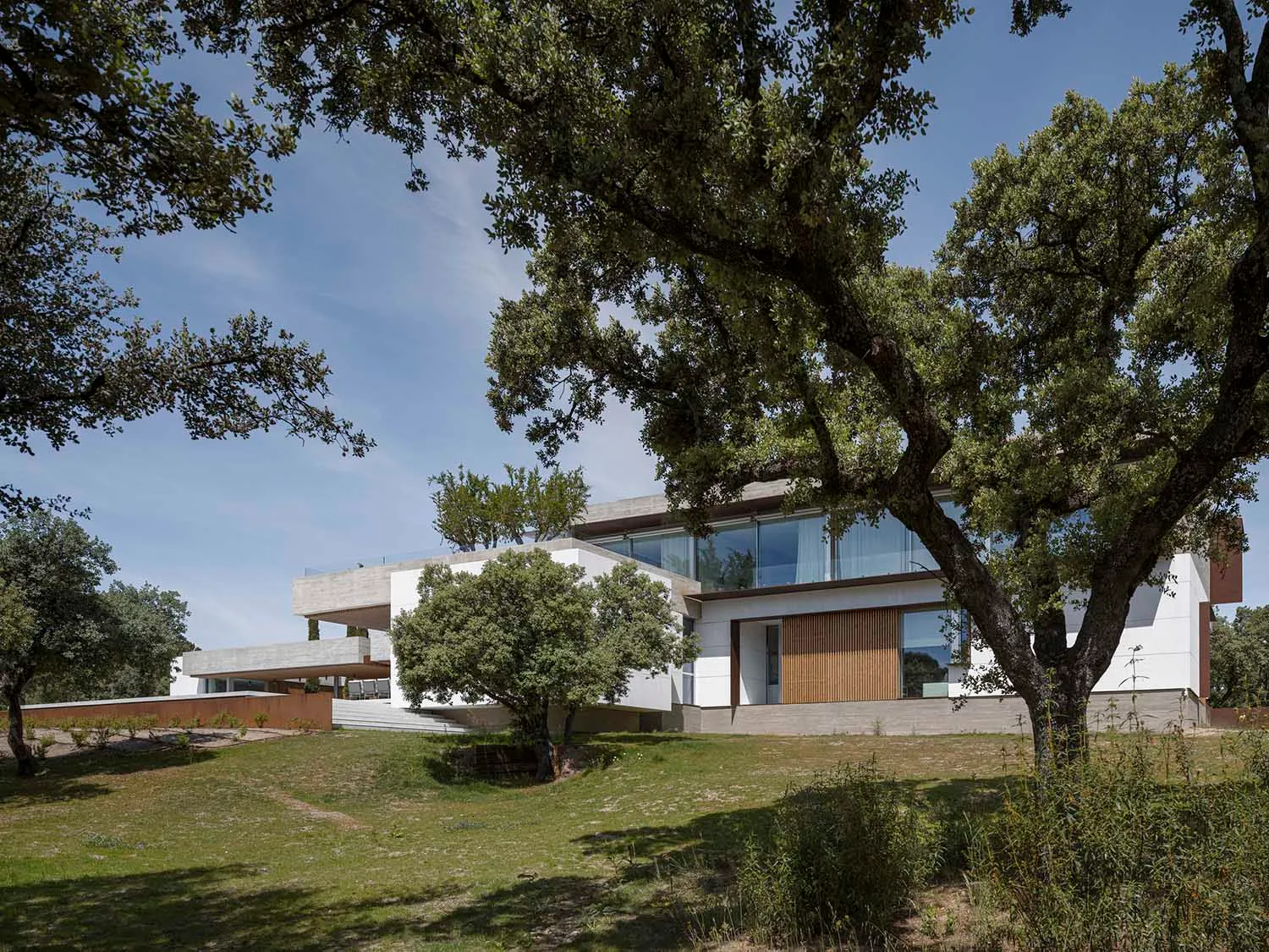 Modern residential building featuring a concrete and glass exterior