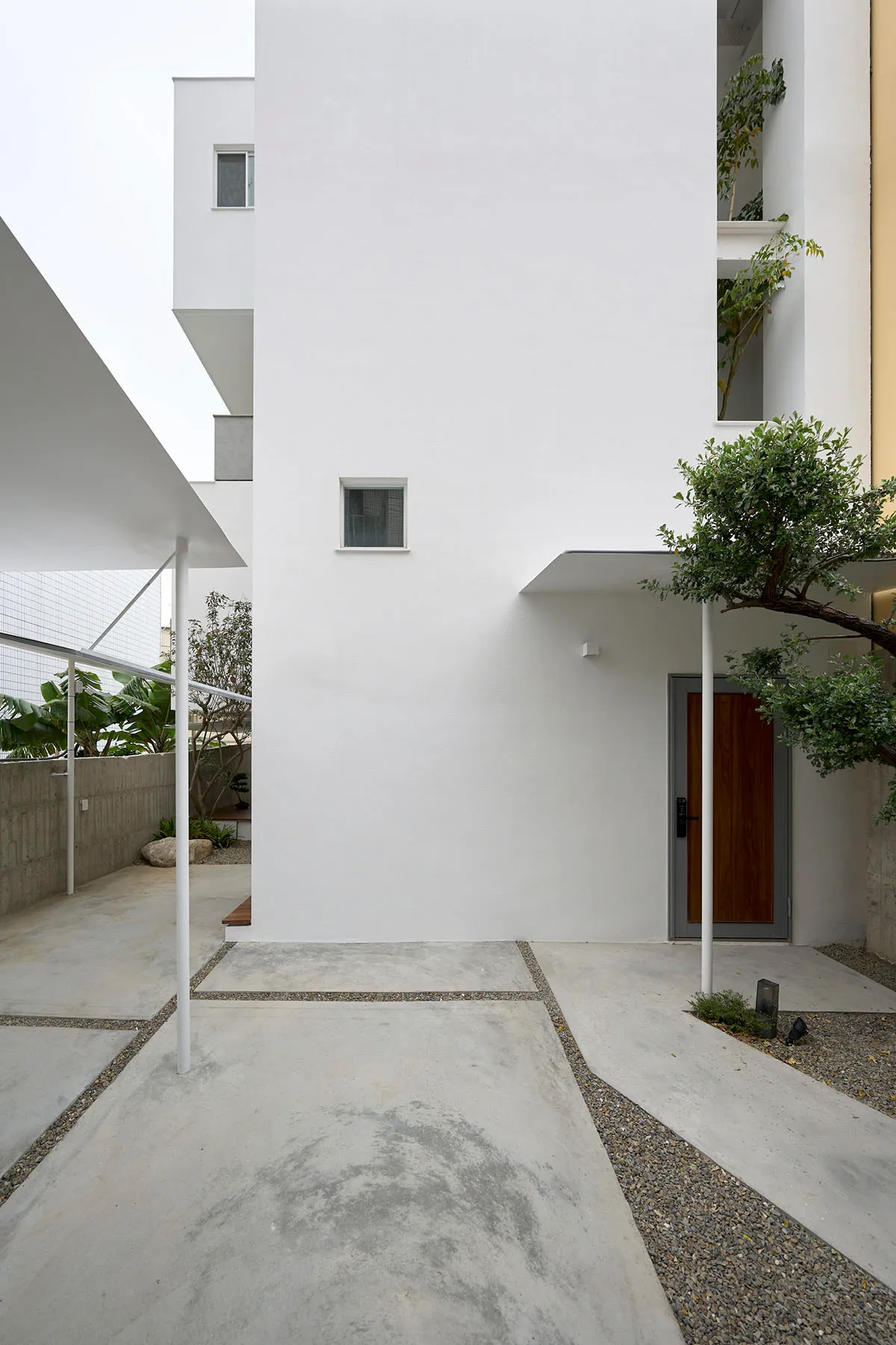 Concrete entrance with minimalist design and modern architectural features.
