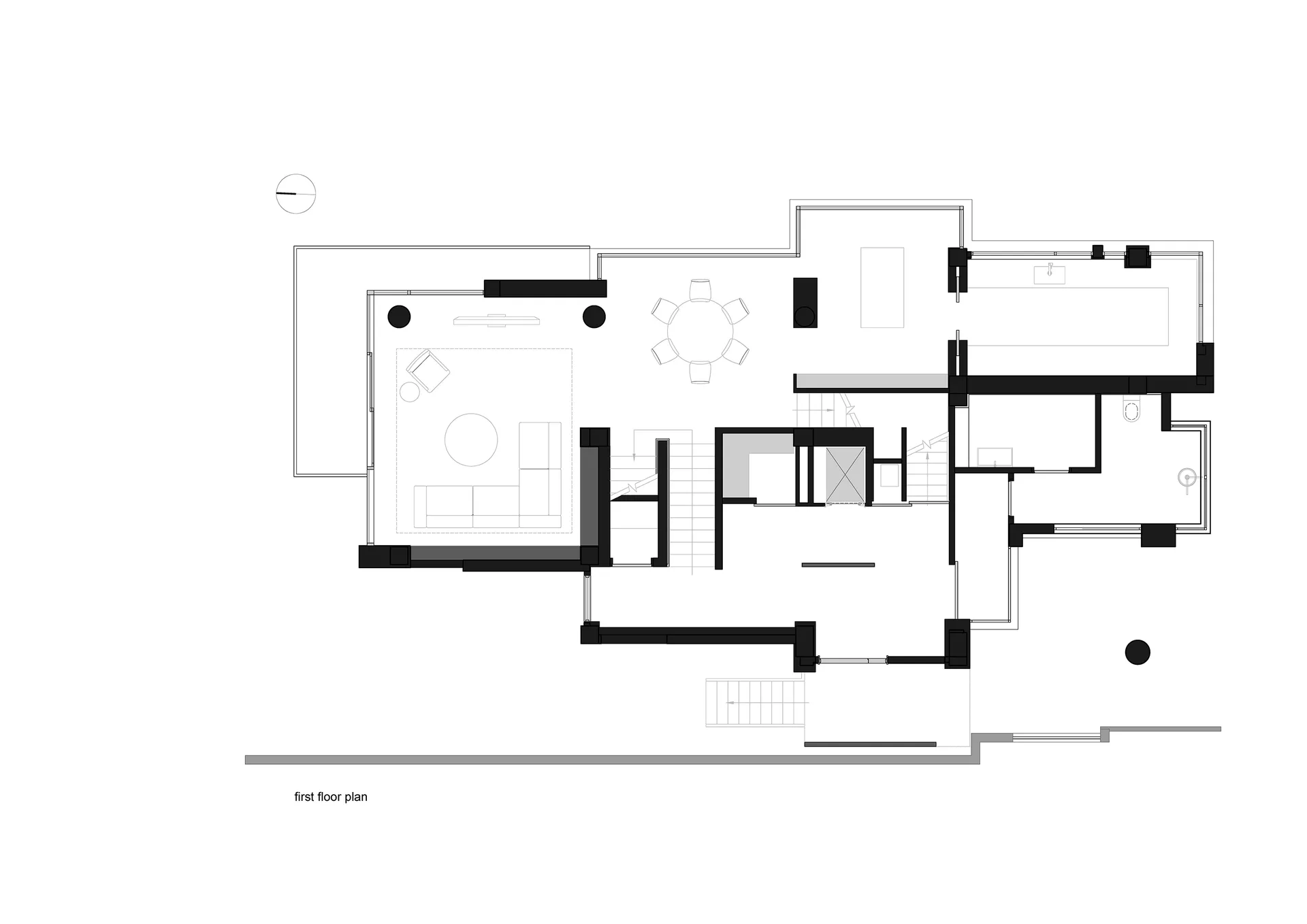 A detailed black and white architectural drawing of a residential floor plan with modern design elements.