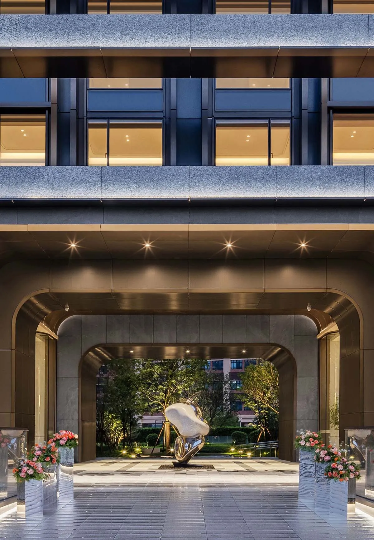 Modern hotel lobby with concrete and glass architectural elements