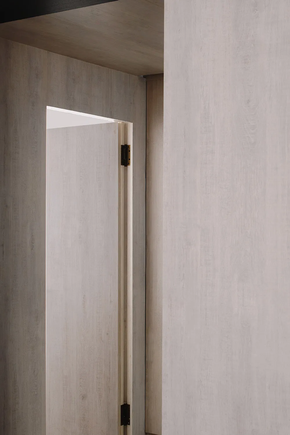 Modern minimalist interior design featuring wooden walls.