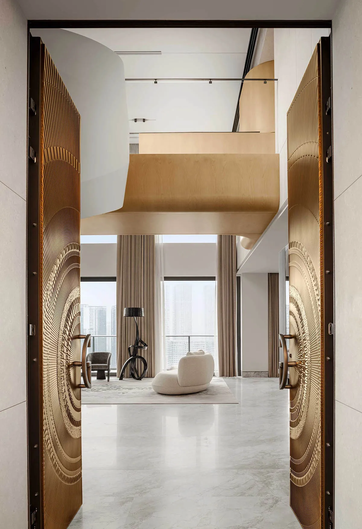 A modern living room featuring marble flooring, glass and wood furniture, and a minimalist decor.