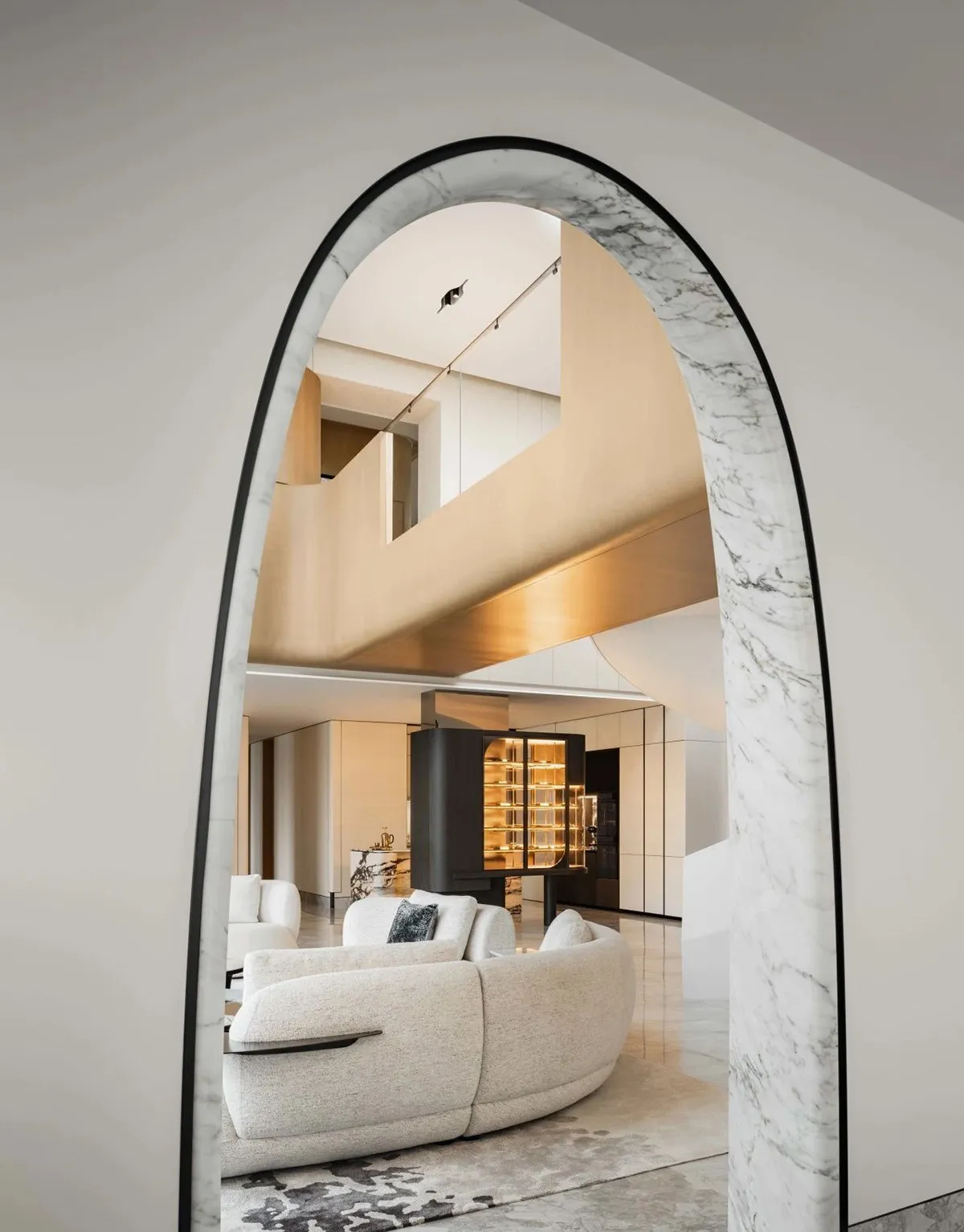 A modern interior design featuring marble materials and contemporary furniture.