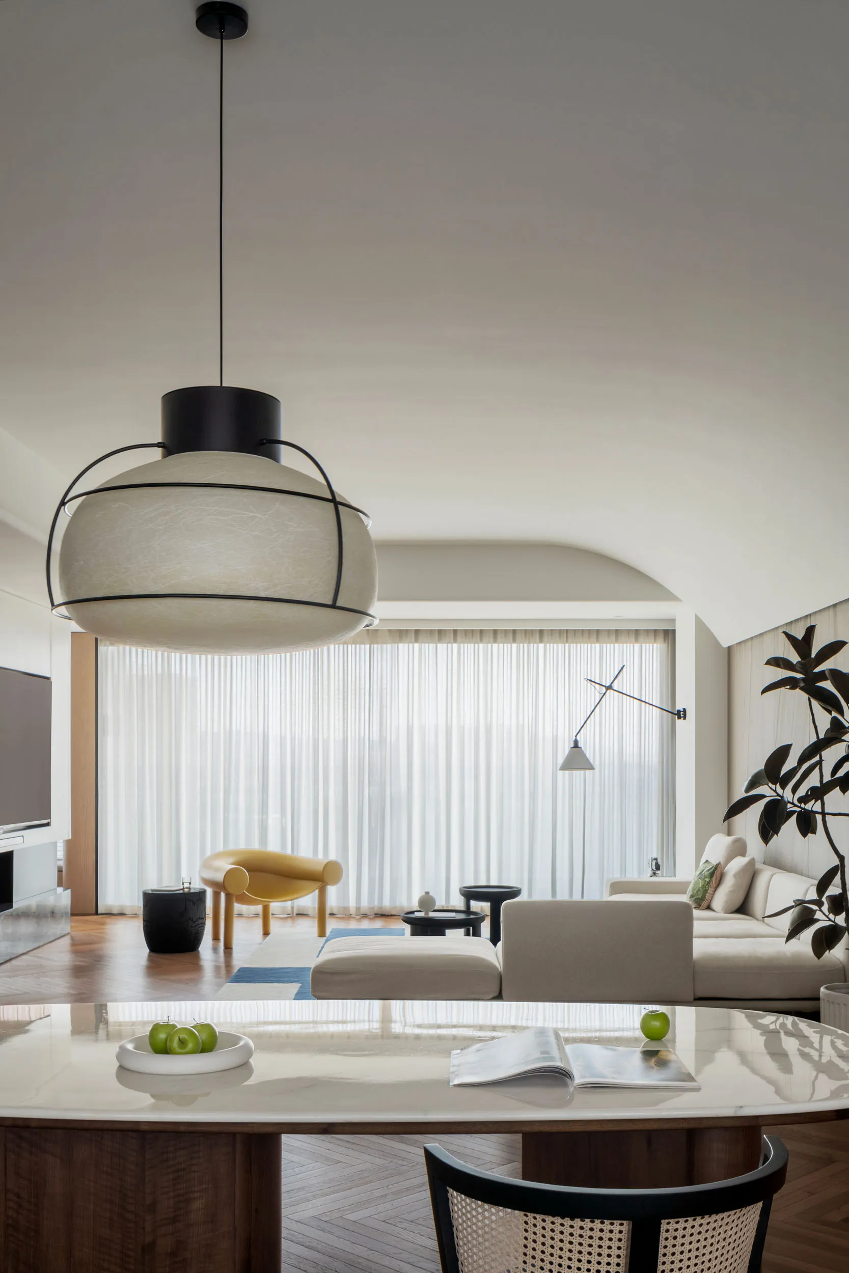 A minimalist living room featuring neutral tones and modern furniture.