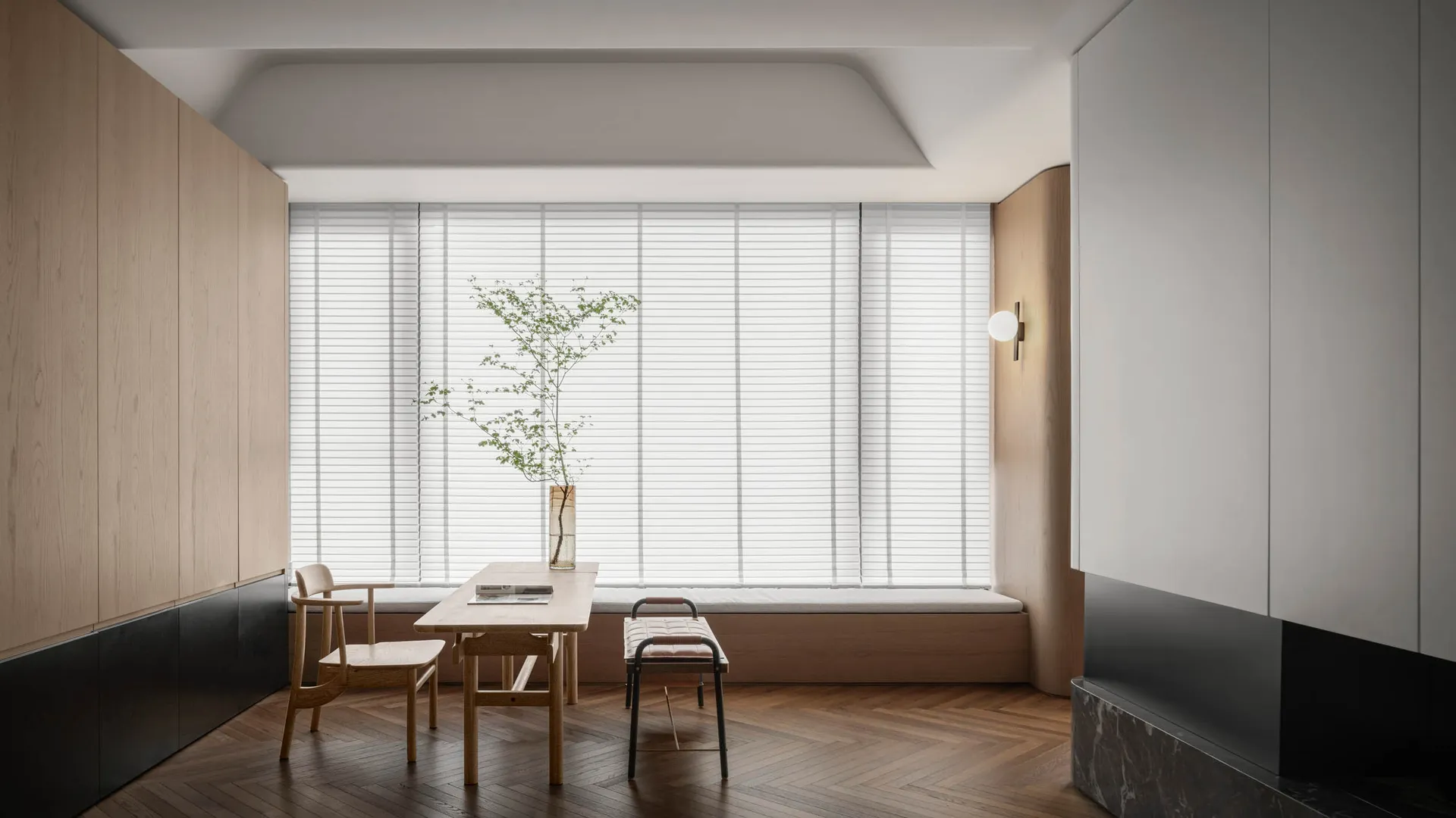 Modern minimalist living room featuring wooden furniture and white blinds.
