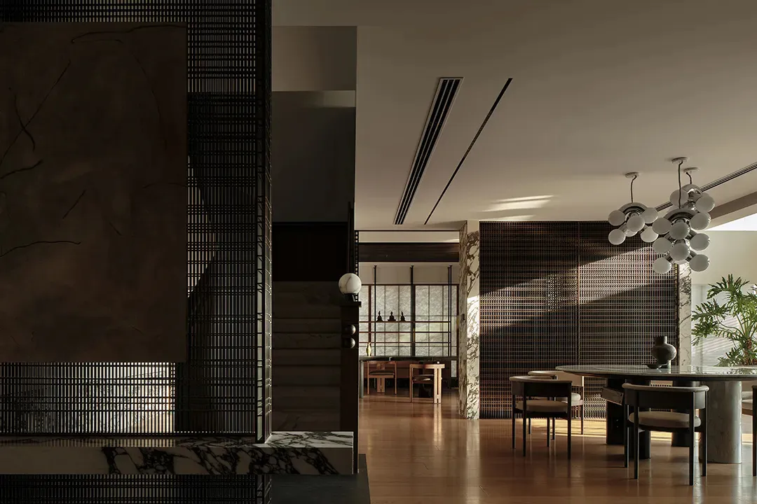 A minimalist residential interior featuring stone and wood materials