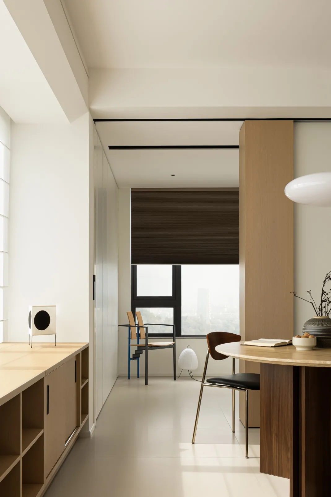 A modern interior design featuring wooden furniture, glass elements, and metal accents.