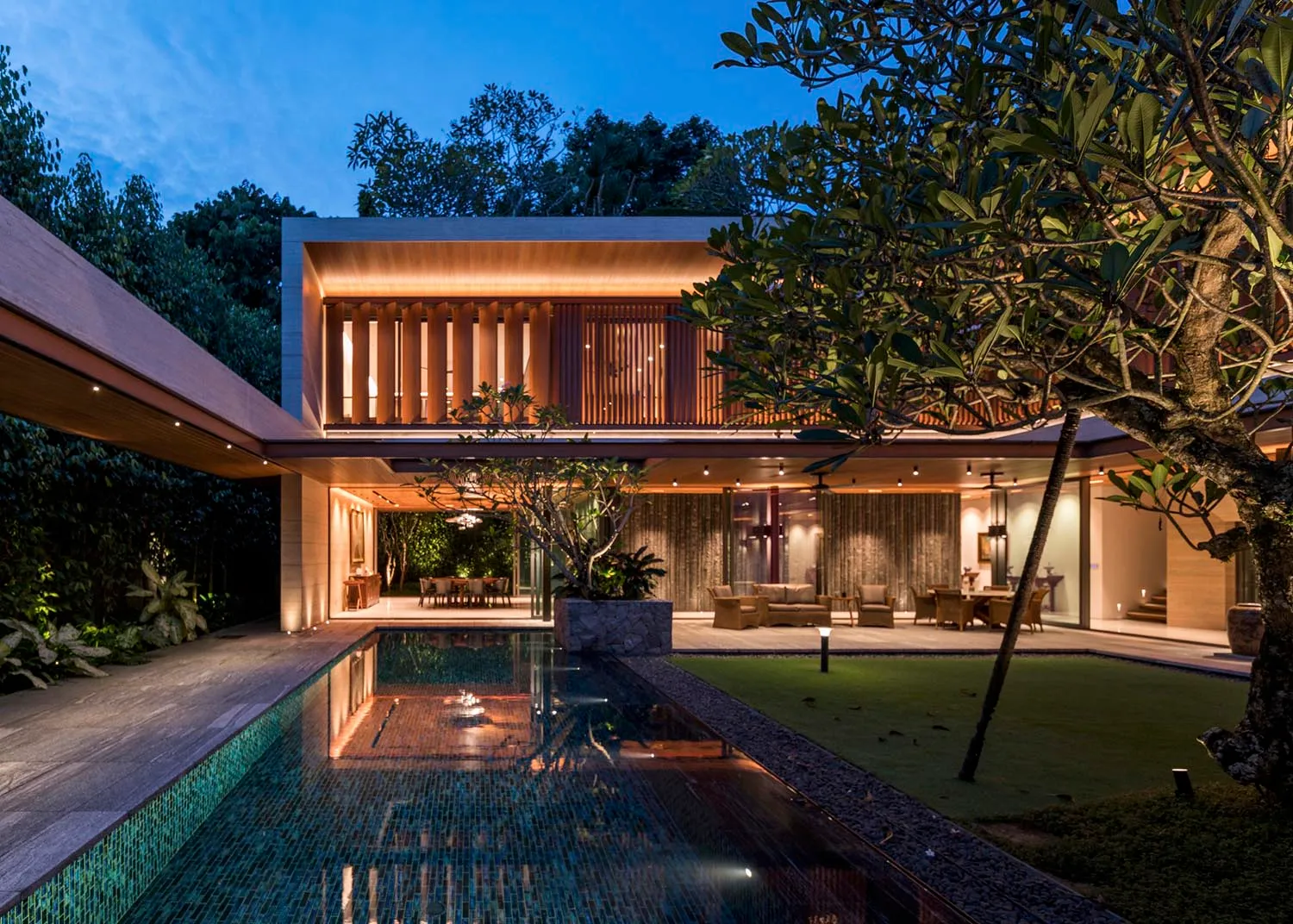 Modern house with concrete and glass exterior features.