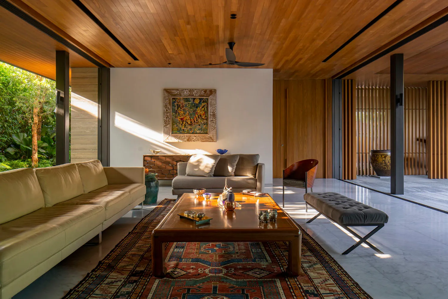 Modern living room with wooden furniture and a patterned rug