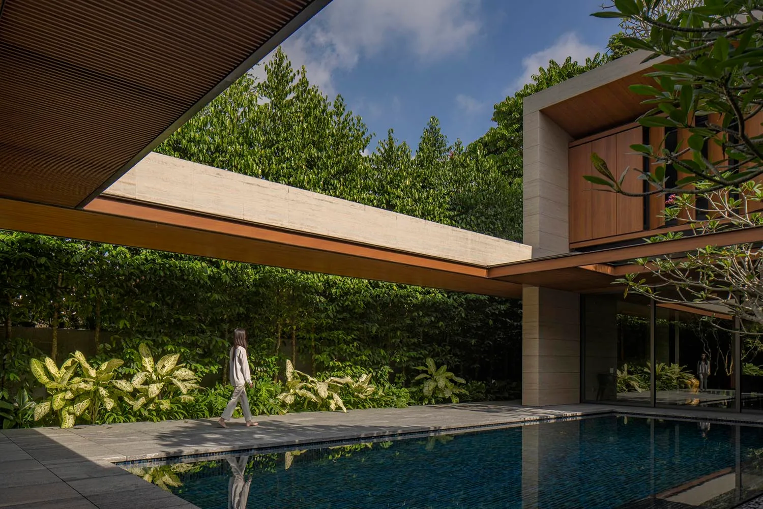 A modern house featuring stone and wood materials.