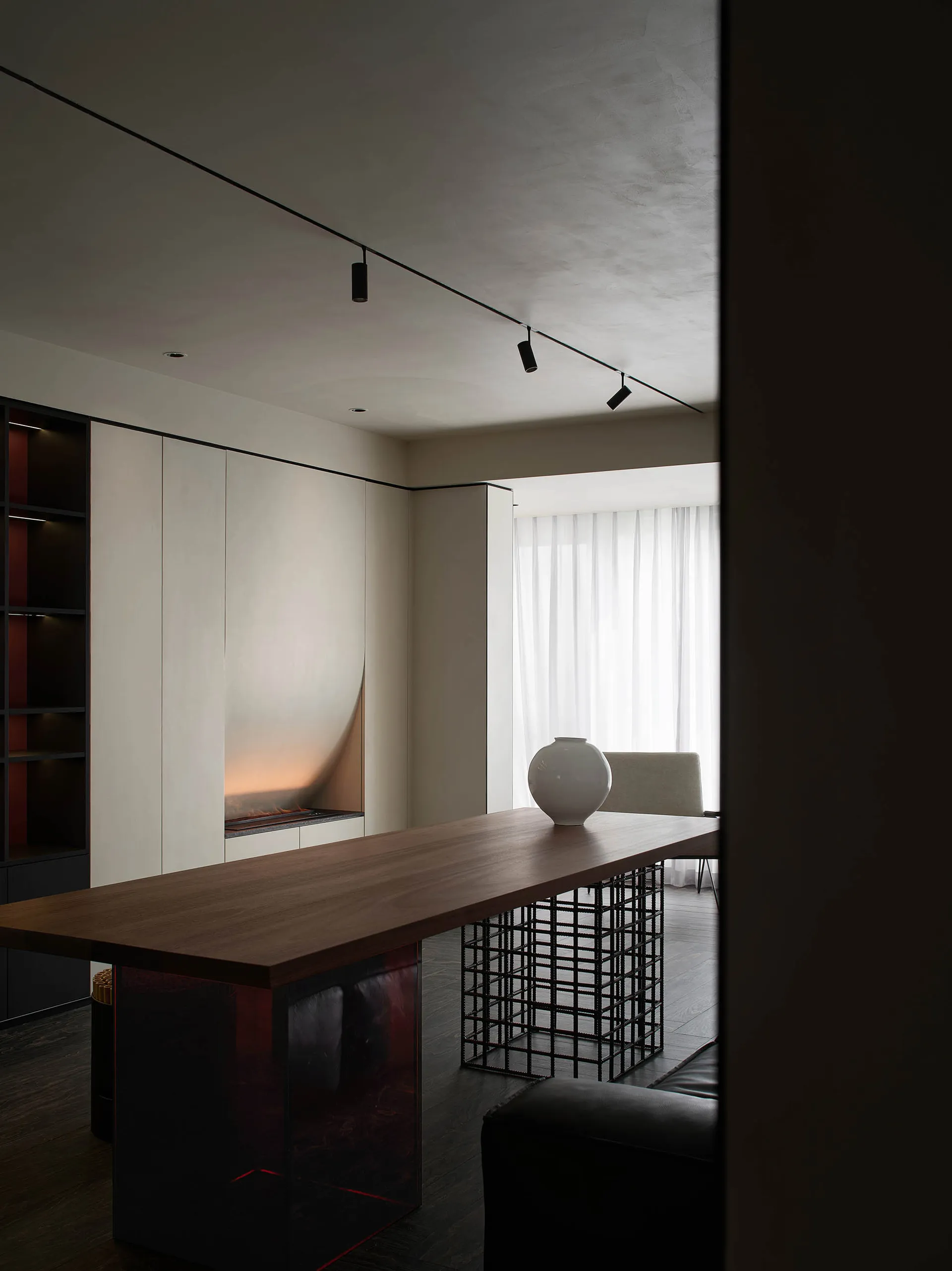 Modern minimalist office studio with wood table and minimalist design elements.