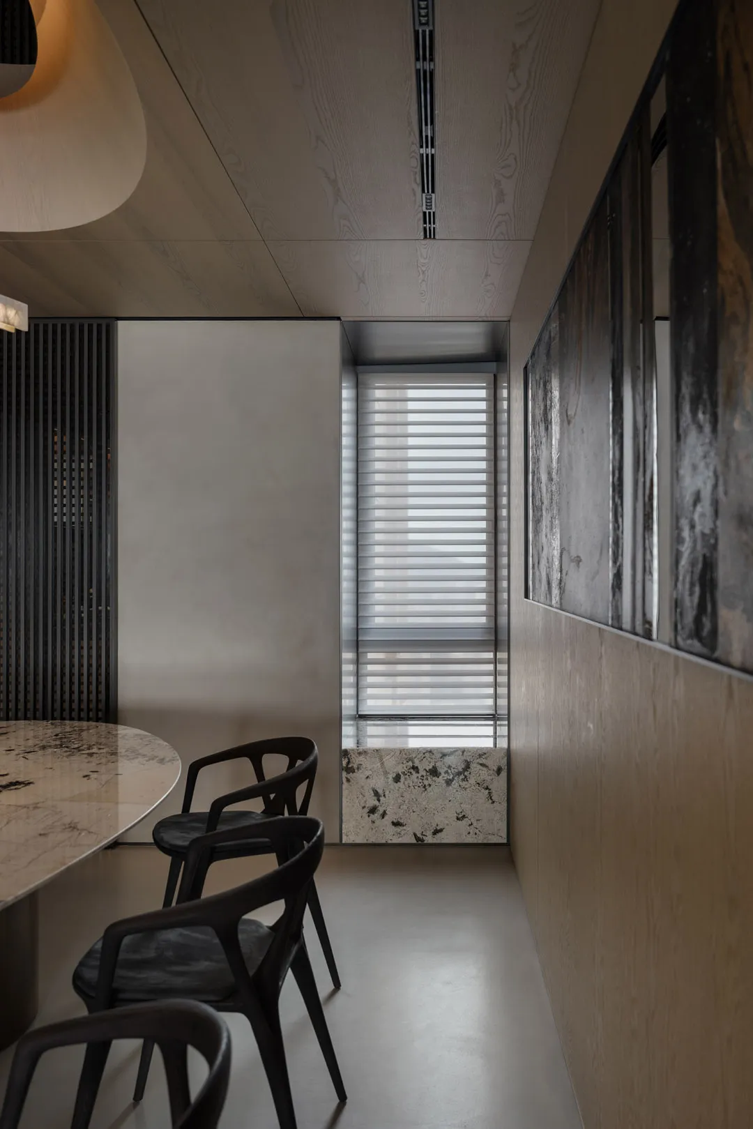 A modern office space features sleek metal and glass materials.